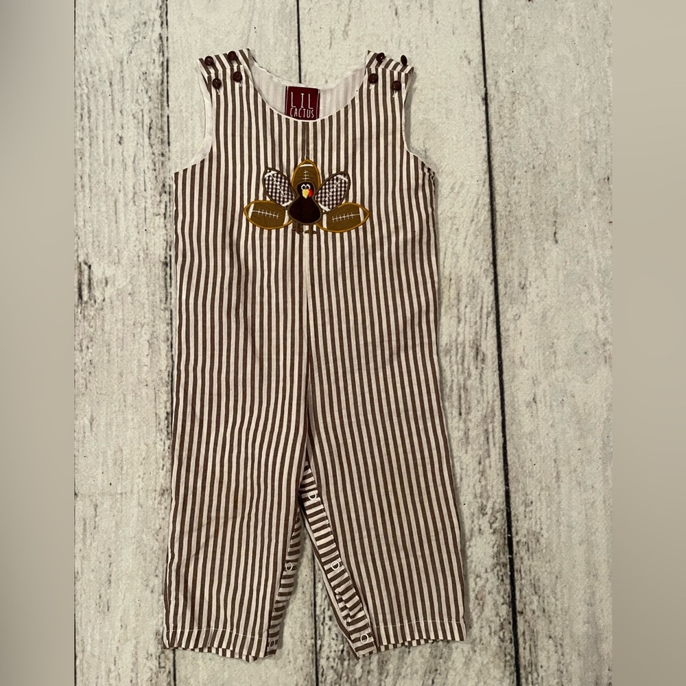 18-24m boys Longall brown and white stripped with Turkey football feathers